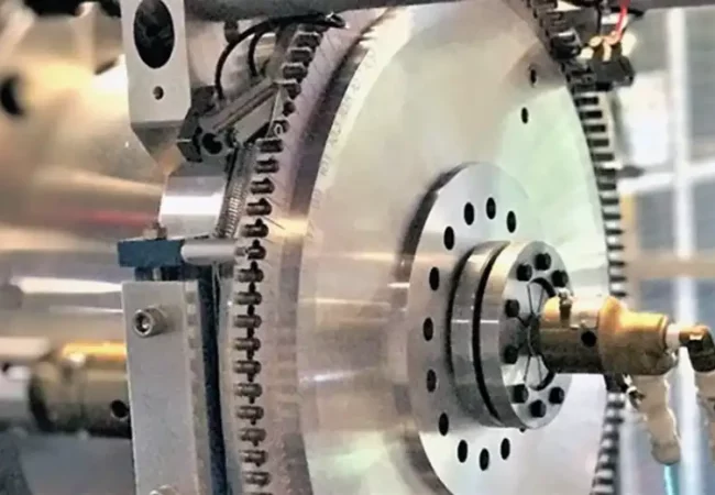 Close-up of high-precision analytical instrumentation used for ultra-sensitive detection in pharmaceutical research, featuring intricate metallic components.