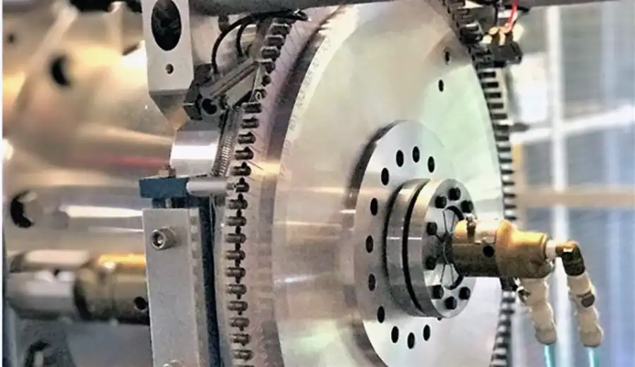 Close-up of high-precision analytical instrumentation used for ultra-sensitive detection in pharmaceutical research, featuring intricate metallic components.