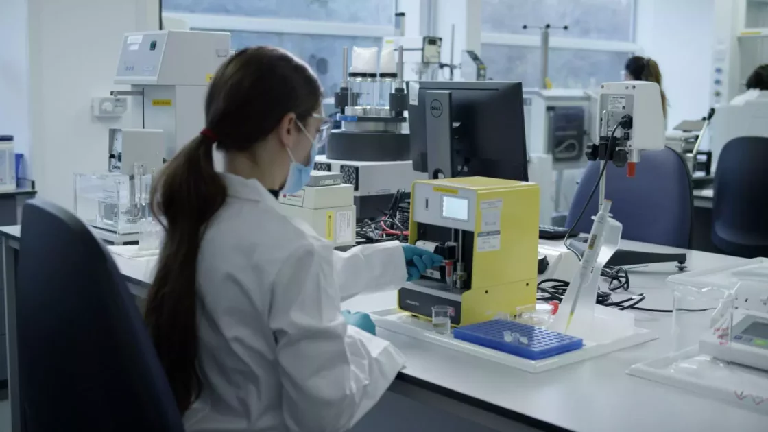 Scientists work in a formulation lab, conducting experiments and using analytical instruments to develop pharmaceutical formulations.