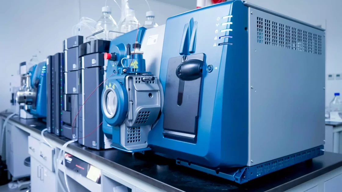 Close-up of advanced laboratory equipment used for pharmacokinetic (PK) analysis of biologics in drug development.