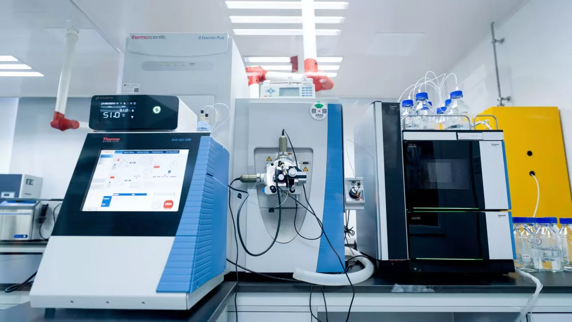 High-resolution mass spectrometry (HRMS) setup featuring Thermo Scientific instruments in a lab, used for precise molecular analysis and identification.