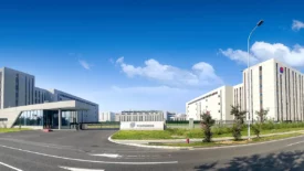 Pharmaron Ningbo Campus III featuring clean-lined research buildings, a gated entrance, and clear campus signage under a bright blue sky.